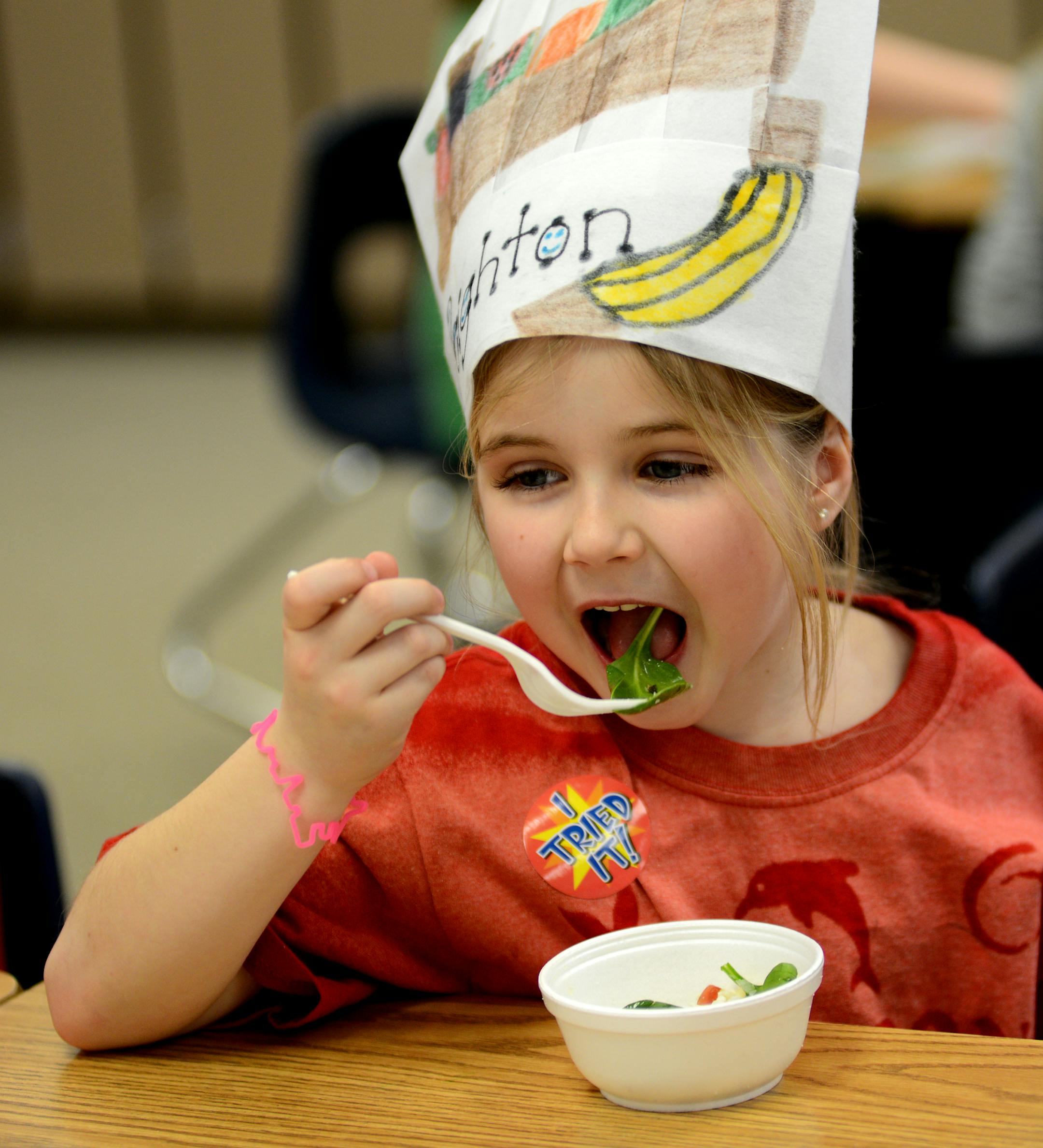 At the Red Pine Elementary School the goal of the Food Explorers program is to get kids eating more fruits and vegetables. To do this, they go into schools and teach kids about nutrition, including how to prepare recipes that are healthy and taste good. First graders made superhero salads that featured spinach,apples and cheese. Peighton Forster liked her superhero salad and finished all of it.] Richard.Sennott@startribune.com Richard Sennott/Star Tribune Eagan , Minn. Friday 2/11/2014) ** (cq)