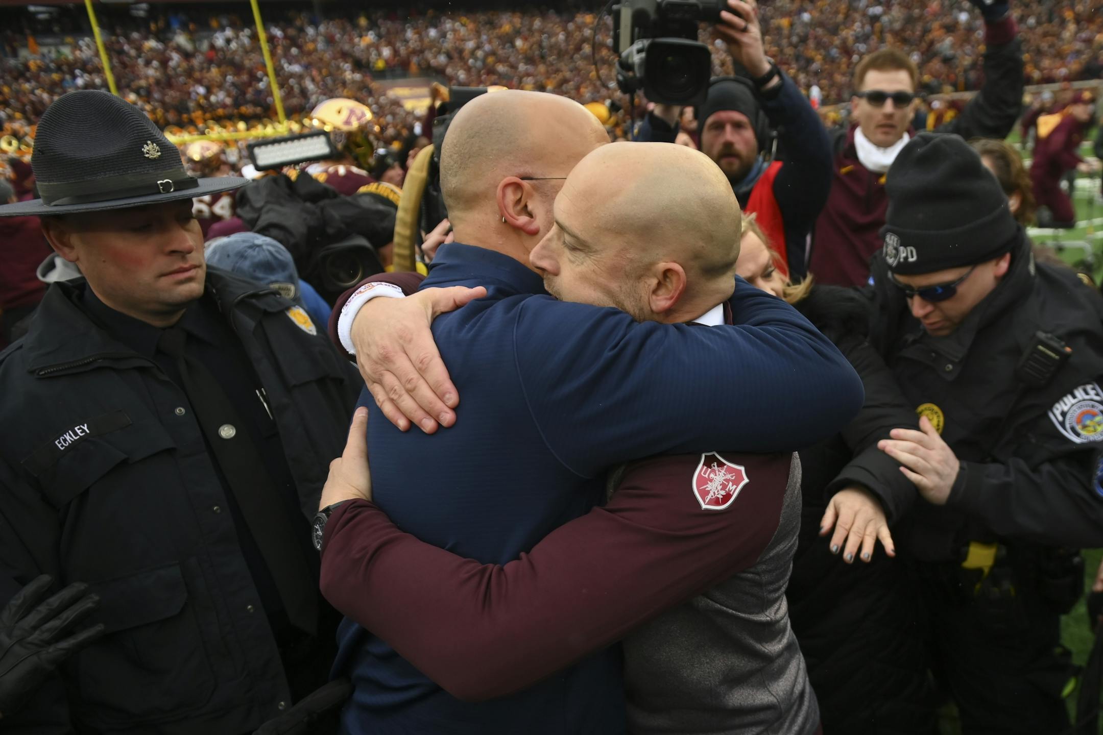 Minnesota Gophers head coach P.J. Fleck and Penn State Nittany Lions head coach James Franklin embraced following the Gophers' victory.
