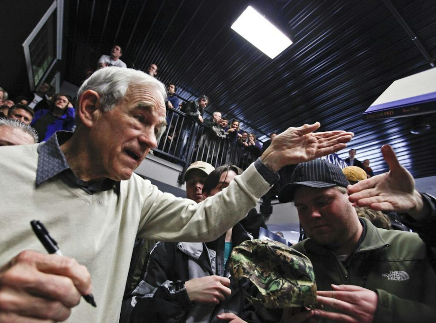 Republican Presidential candidate Ron Paul shook hands with supporters and signed books after bringing his campaign to the Chanhassen Town Hall to an overflow crowd Saturday, Feb. 4, 2012, in Chanhassen, MN.