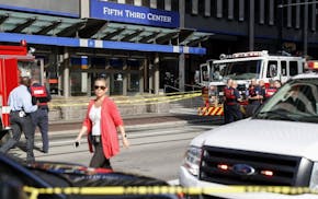 Emergency personnel and police respond to a reported active shooter situation near Fountain Square, Thursday, Sept. 6, 2018, in Cincinnati.