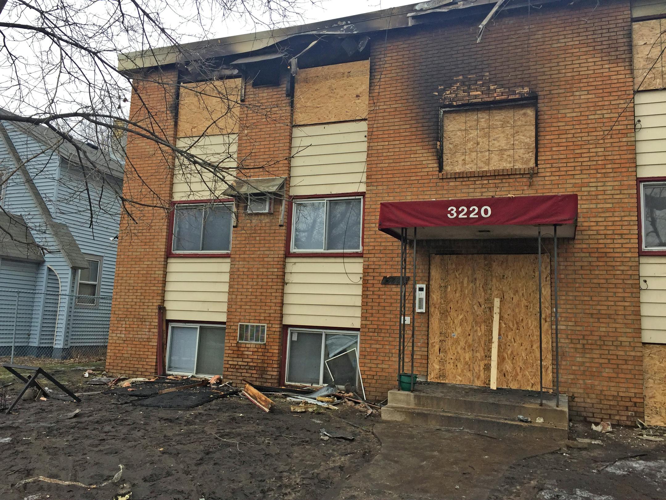 Damage is apparent at the apartment building at 3220 Portland Ave. S., Minneapolis, the morning after a fire at the building injured six people.