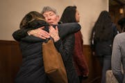 Linda Thompson, the former administrative assistant in the dental hygiene program at Argosy University, hugs a student after the hearing.