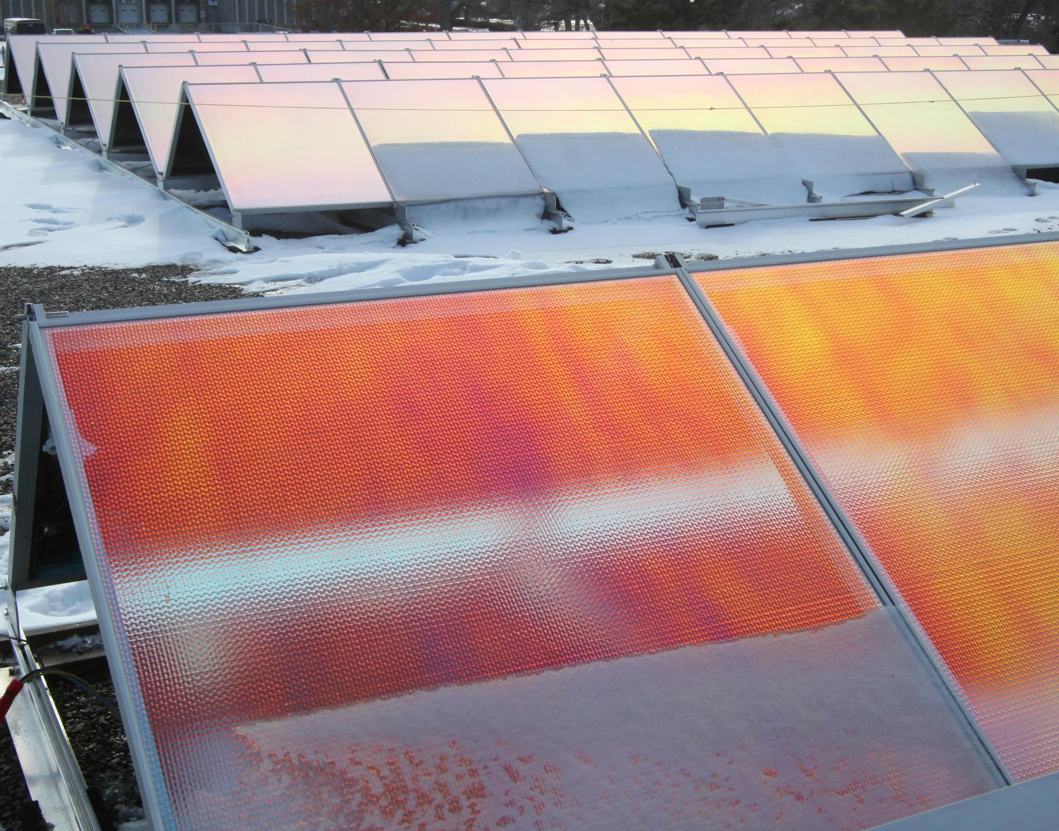 Reflective backs on solar arrays reflected the suns rays. President and Founder of tenKsolar, Dallas Meyer, talked about how how the tenKsolar company solar arrays were designed to work in snow conditions, like those encountered in Minnesota. The solar arrays were mounted on the roof of the Bloomington company headquarters. He was photographed on 1/26/12.] Bruce Bisping/Star Tribune bbisping@citilink.com. ORG XMIT: MIN2013030516214321