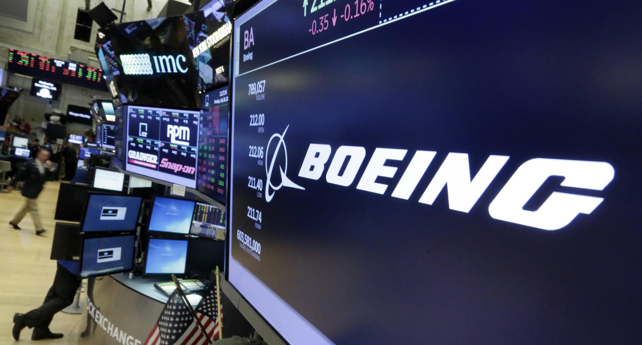 In this Monday, July 24, 2017, photo, the Boeing logo appears above a trading post on the floor of the New York Stock Exchange. The Boeing Co. reports earnings, Wednesday, July 26, 2017. (AP Photo/Richard Drew)