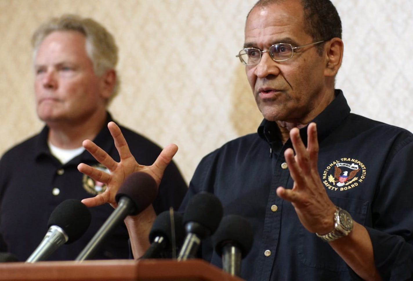 NTSB investigator in charge Roger Evans, left, with board member Christopher Hart. Hart told reporters Thursday it would take up to a year to resolve the "why" as to what caused the the explosion at Minnehaha Academy.