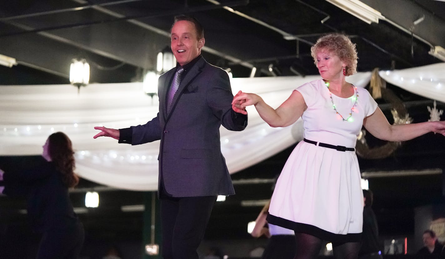 Scott Anderson invited former student Paula Nees onto the dance floor during a "Blues A Palooza" gig at the Medina Entertainment Center.