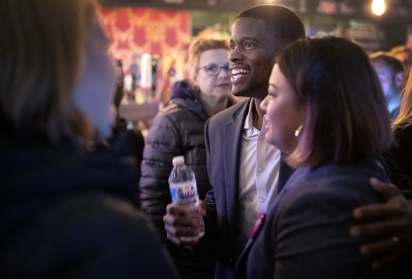 St. Paul Mayor Melvin Carter joined those at Black Hart of St. Paul celebrating as the yes forces won in the vote of the city's trash-collection system.