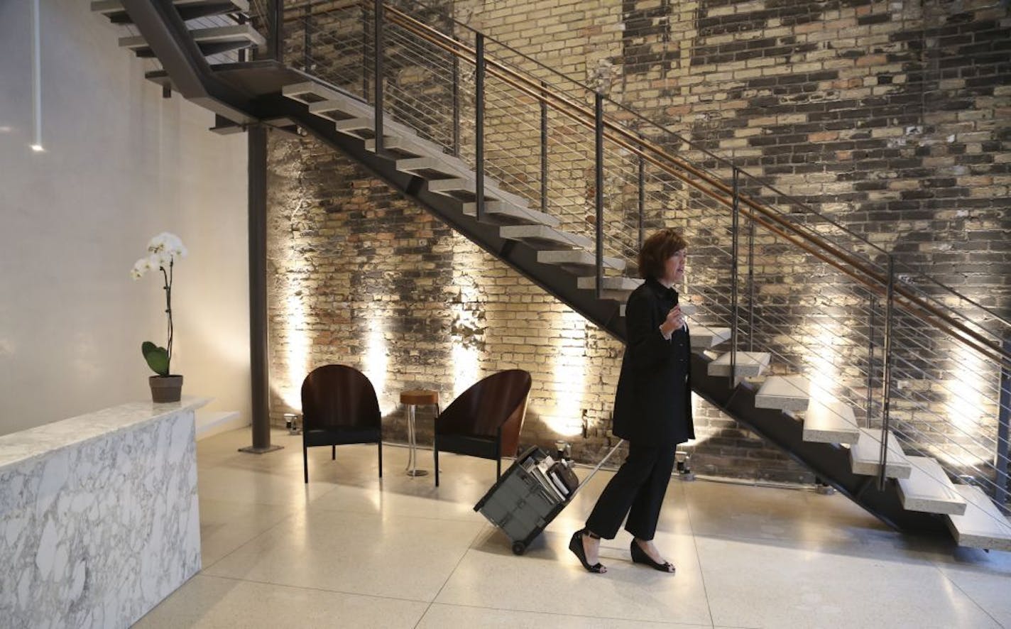 Sales representative Kristen Bruner waited in the front lobby at Shea, a design firm, that has relocated in the old Shinder's bookstore building.in Minneapolis, Min., Friday November 9, 2012.