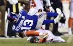 New York Giants wide receiver Odell Beckham (13) is tackled by Cleveland Browns strong safety Briean Boddy-Calhoun (20) in the first half of an NFL pr