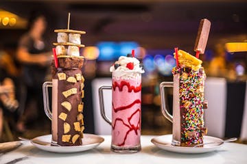 The Insane Milkshakes at Sugar Factory come in chocolate-dipped mugs.