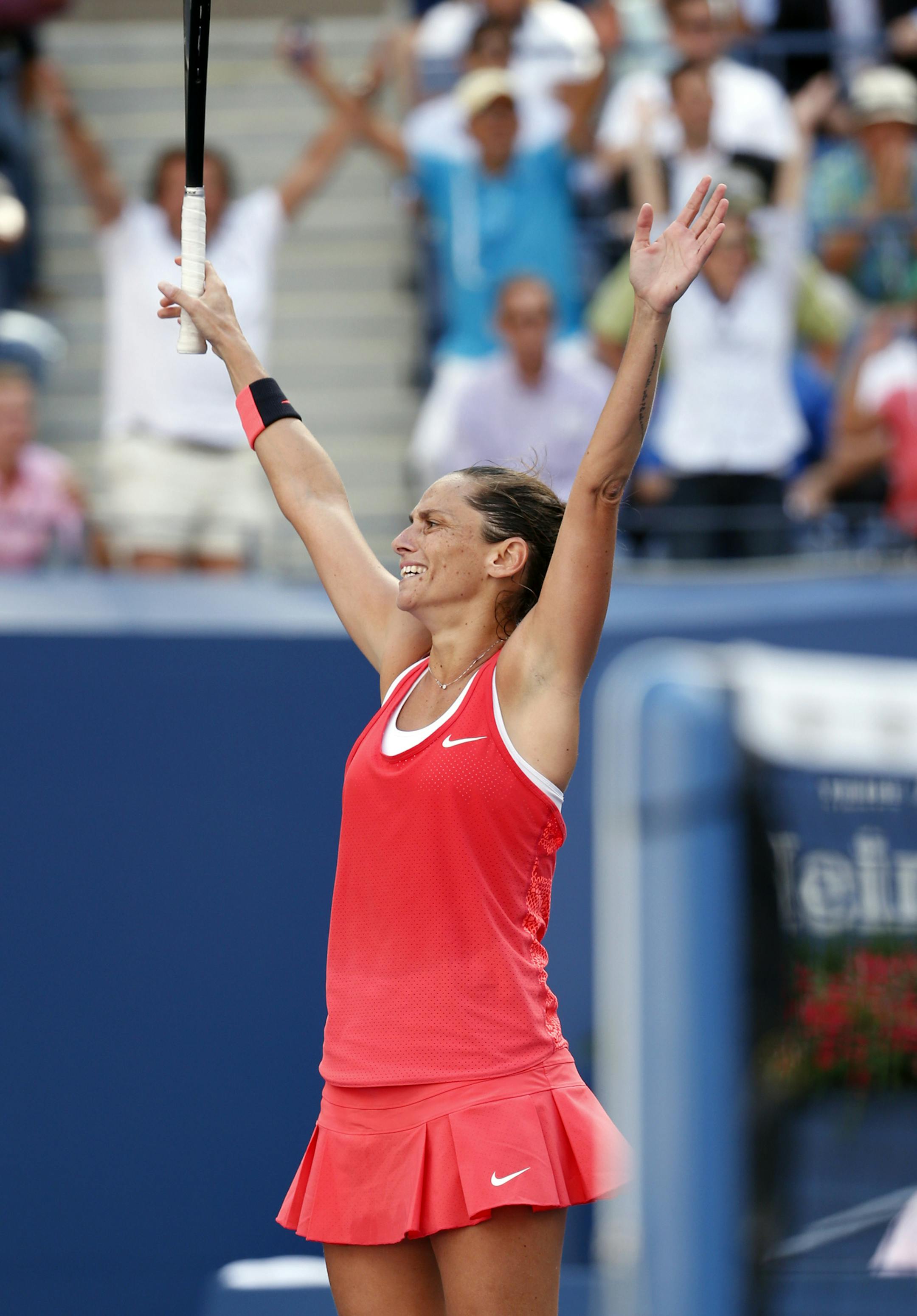 Roberta Vinci, of Italy, reacts after beating Serena Williams during a semifinal match at the U.S. Open tennis tournament, Friday, Sept. 11, 2015, in New York. (AP Photo/Julio Cortez)