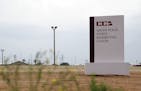 File-This June 30. 2015, file photo shows a sign at the entrance to the South Texas Family Residential Center in Dilley, Texas. Authorities say about 