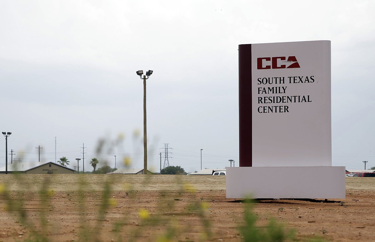 File-This June 30. 2015, file photo shows a sign at the entrance to the South Texas Family Residential Center in Dilley, Texas. Authorities say about 250 immigrant children were given an adult dose of a Hepatitis A vaccine at a Texas detention facility where they are being held with their mothers. U.S. Immigration and Customs spokesman Richard Rocha says health care professionals will monitor the children over the next five days for any potential side effects, though no adverse reactions are exp