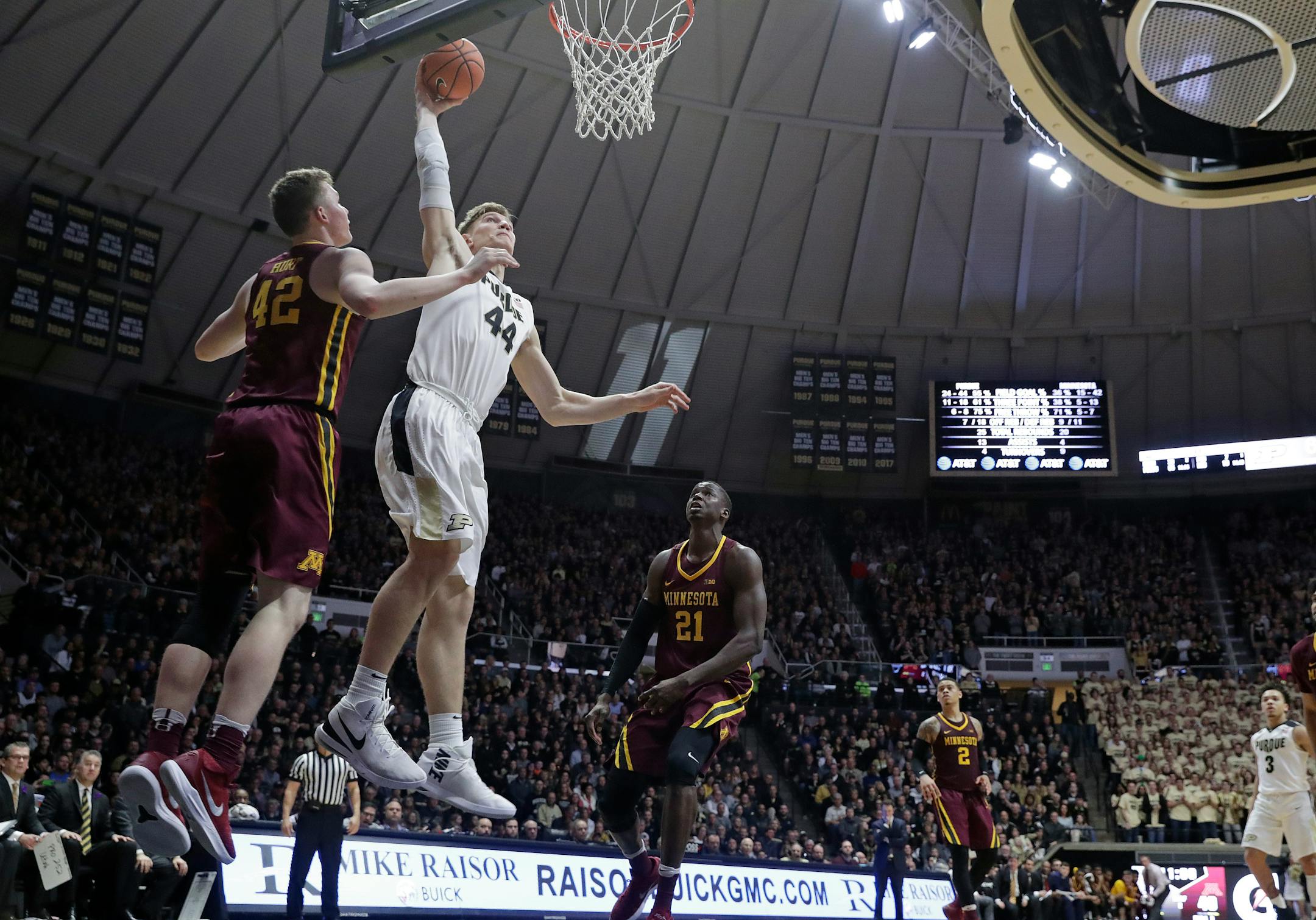 Purdue center Isaac Haas (44) dunked in front of Gophers forward Michael Hurt in the second half Sunday. No. 9 Purdue defeated Minnesota 84-60.