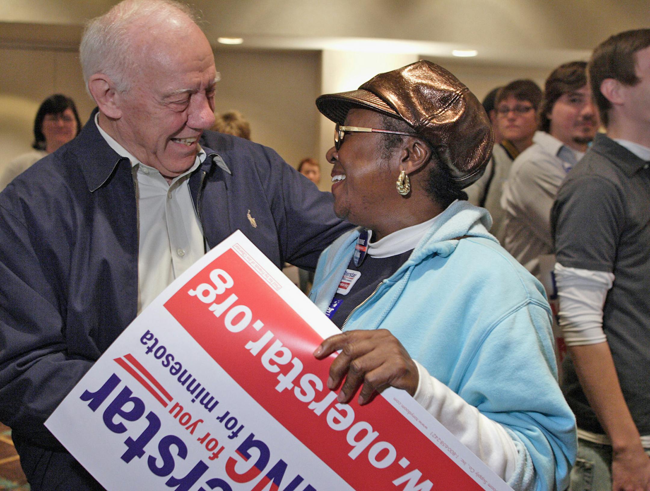 In this photo taken Oct. 3, 2010, U.S. Rep. Jim Oberstar, D-Minn., greets supporter and friend Jettie Ann Hill, right, of Minneapolis during a morning rally of MAPE union workers in Duluth, Minn. Oberstar is running for re-election to the 8th District House seat he has held since 1975. (AP Photo/Julia Cheng)
