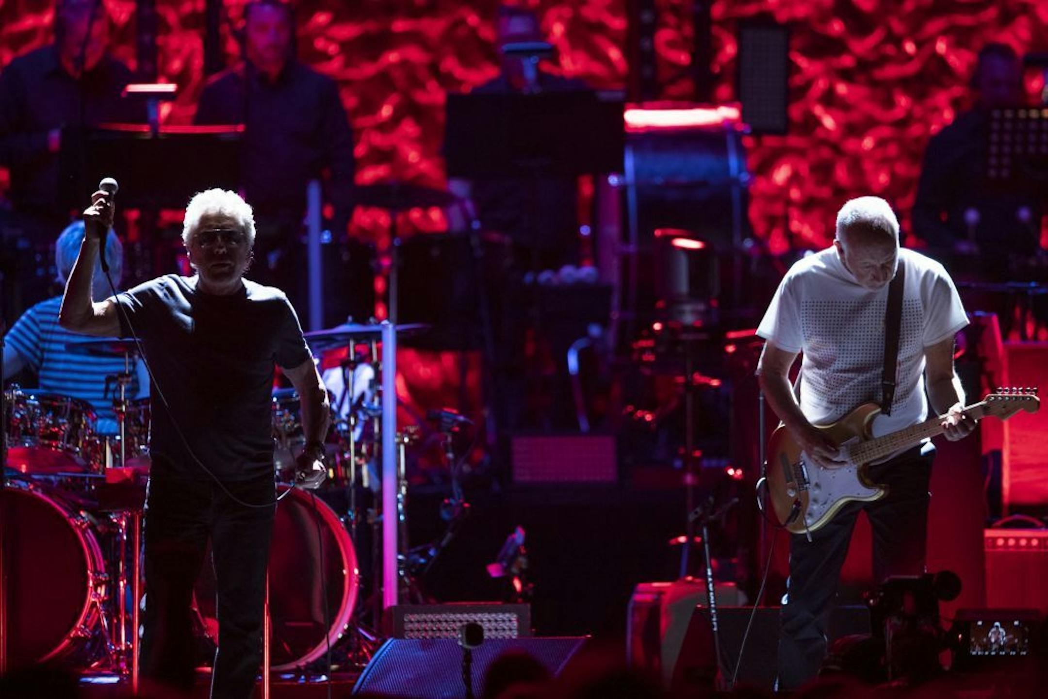 Lead singer Roger Daltrey with guitarist Pete Townshend during Amazing Journey early in The Who's show at Xcel Friday night.