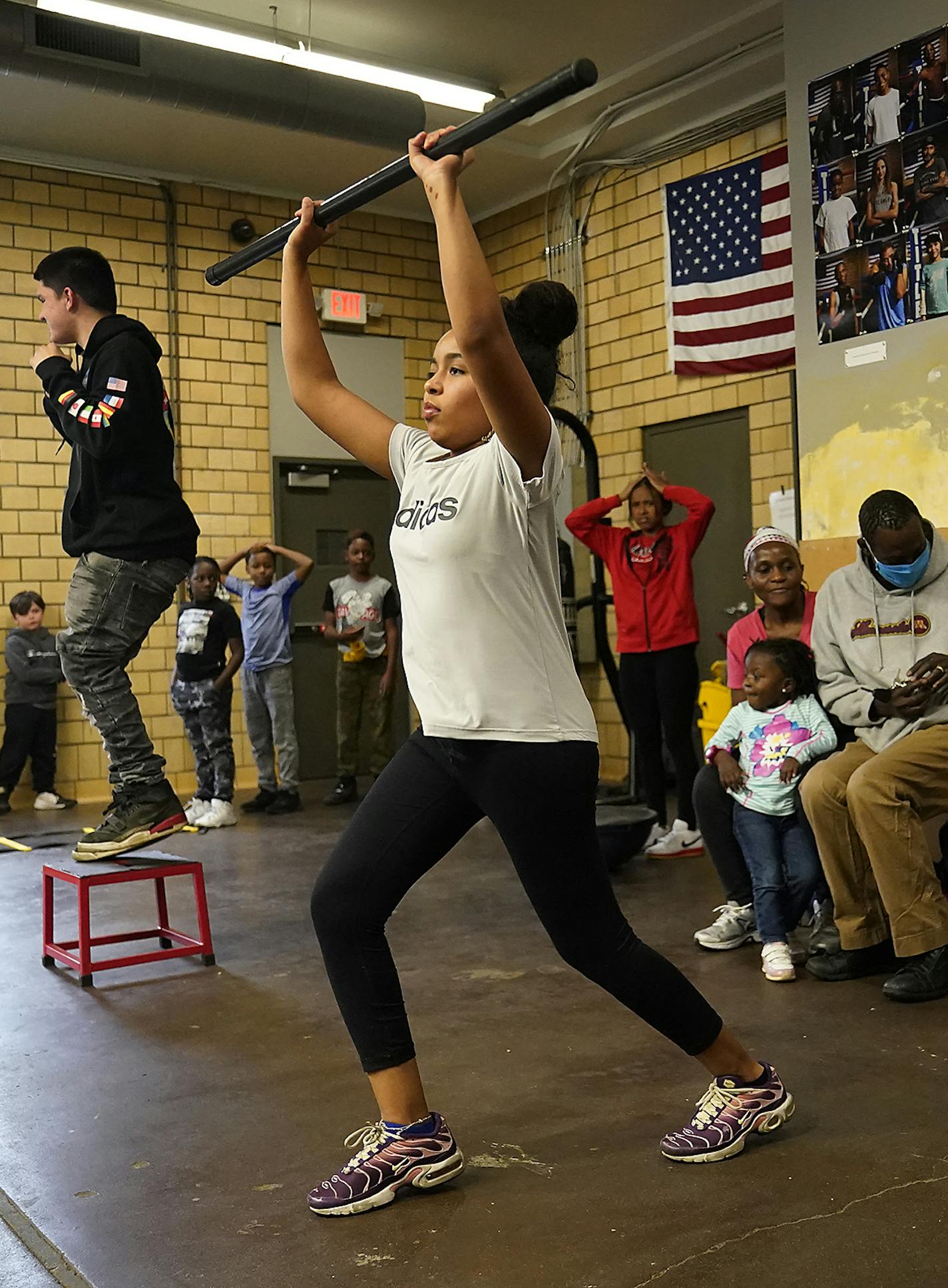 Northside Boxing Club coach Mohammed Kayongo, left, encouraged youth including sisters Aatiqah Haji, 10, right to left, and Fatima Haji, 13, during a class Monday in Minneapolis. ] DAVID JOLES • david.joles@startribune.com Monday, Oct. 19k, 2020 in Minneapolis, MN. Northside Boxing Club was one of 40 groups that received extra grants from the Minneapolis Foundation this year. The foundation gave out $500,000 more this year to support healing, community conversations and racial justice work after