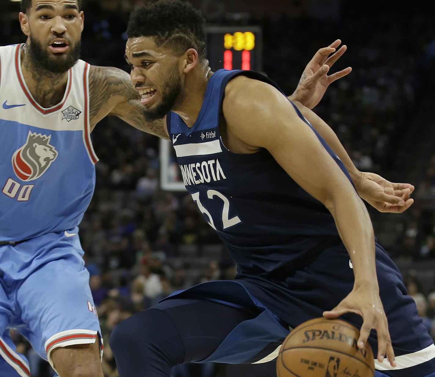 Minnesota Timberwolves center Karl-Anthony Towns, right, drives against Sacramento Kings center Willie Cauley-Stein during the second quarter of an NBA basketball game Monday, Feb. 26, 2018, in Sacramento, Calif. (AP Photo/Rich Pedroncelli)