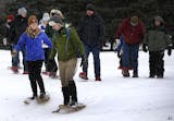 Josh Sweet program and facility specialist at Three Rivers Park District and his wife Jill led a Valentine Snowshoe walk at the New Prague Golf Club on Sunday. ] CARLOS GONZALEZ cgonzalez@startribune.com - February 14, 2016, New Prague, MN, Valentine Snowshoe. Enjoy a casual snowshoe hike through the winter woods with your special someone, Three Rivers Park District, New Prague Golf Club