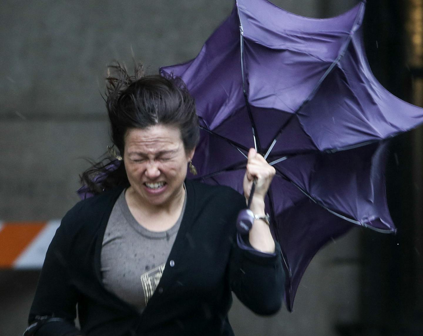 Coming from train opening ceremonies at Union Station April Amys of St. Paul fights gail force winds while making her way Saturday, June 14, 2014, in St. Paul, MN. Amys said the weather was greatly effecting business describing the winds as "pretty trecherous."] (DAVIDJOLES/STARTRIBUNE) djoles@startribune.com After more than a decade of planning and nearly a billion dollars of public money, the Twin Cities' second light-rail line begins running Saturday as officials cut ribbons for the Green Lin