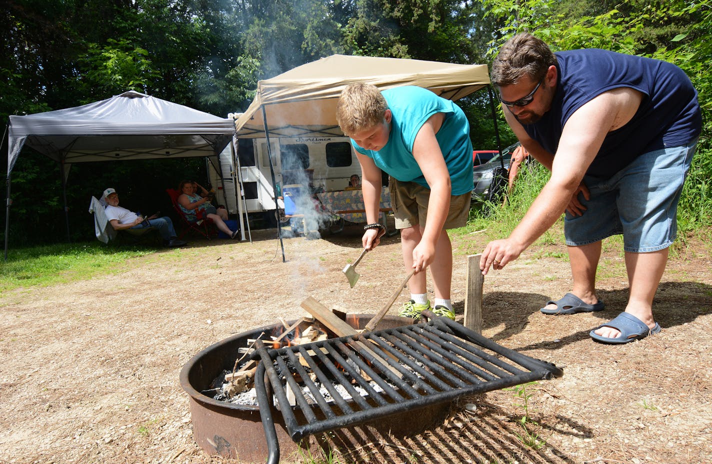 Lebanon Hills Campground: Jacob Robrahn, 10, and his dad, Philip, of Eagan, built a fire during their camping outing.