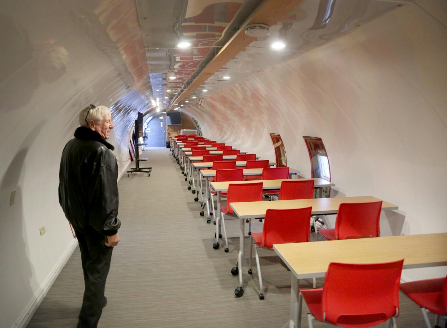 Crews of volunteers and students of the construction trades are working to transform a hangar at the downtown St. Paul airport into a year-round classroom, part of the Learning Jet, a jet and hangar donated to help spark an interest in students, youth groups and scouts who visit as a classroom. Here, Steve Hurvitz, who has spear headed the Learning Jet venture, tours the inside of 727-200, donated by Fed Ex and converted into a classroom Tuesday, Oct. 31, 2017, at Holman Field in St. Paul, MN.