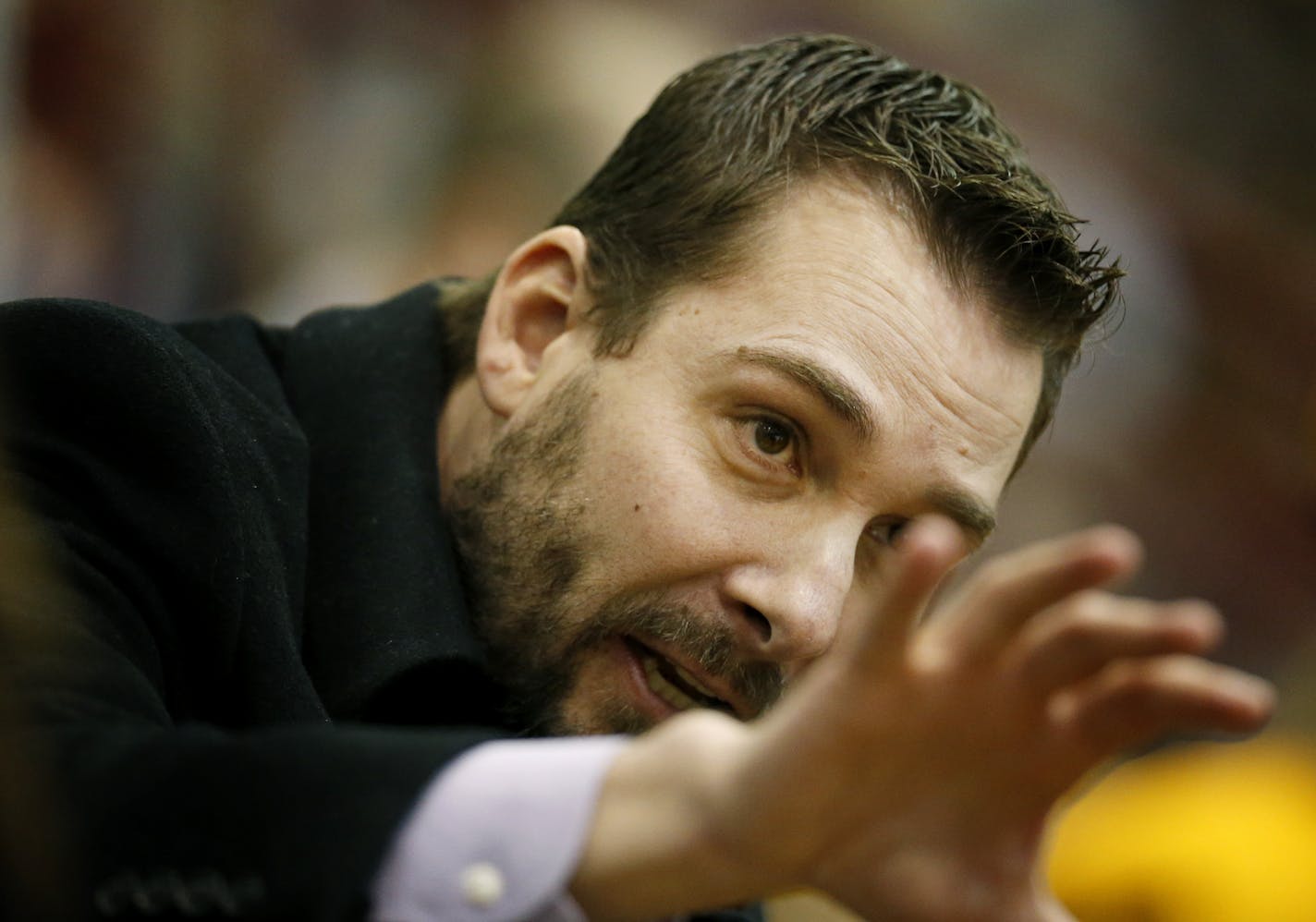 Minnesota head coach Brad Frost gave instructions in the third period during last year's national championship. Minnesota beat Boston University by a final score of 6-3 to win the NCCA National Championship.