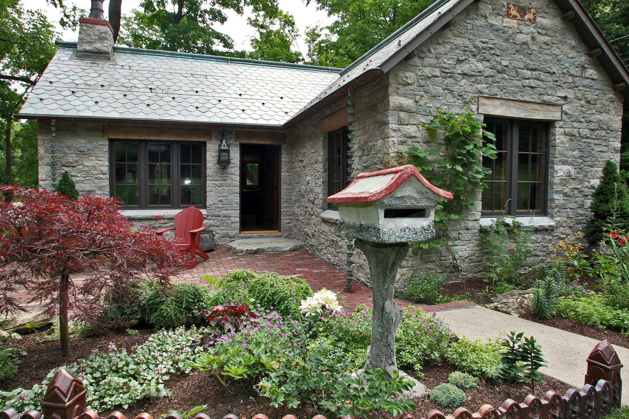 Newly renovated stone cottage with Old Age French features in Deephaven. Exterior of cottage.