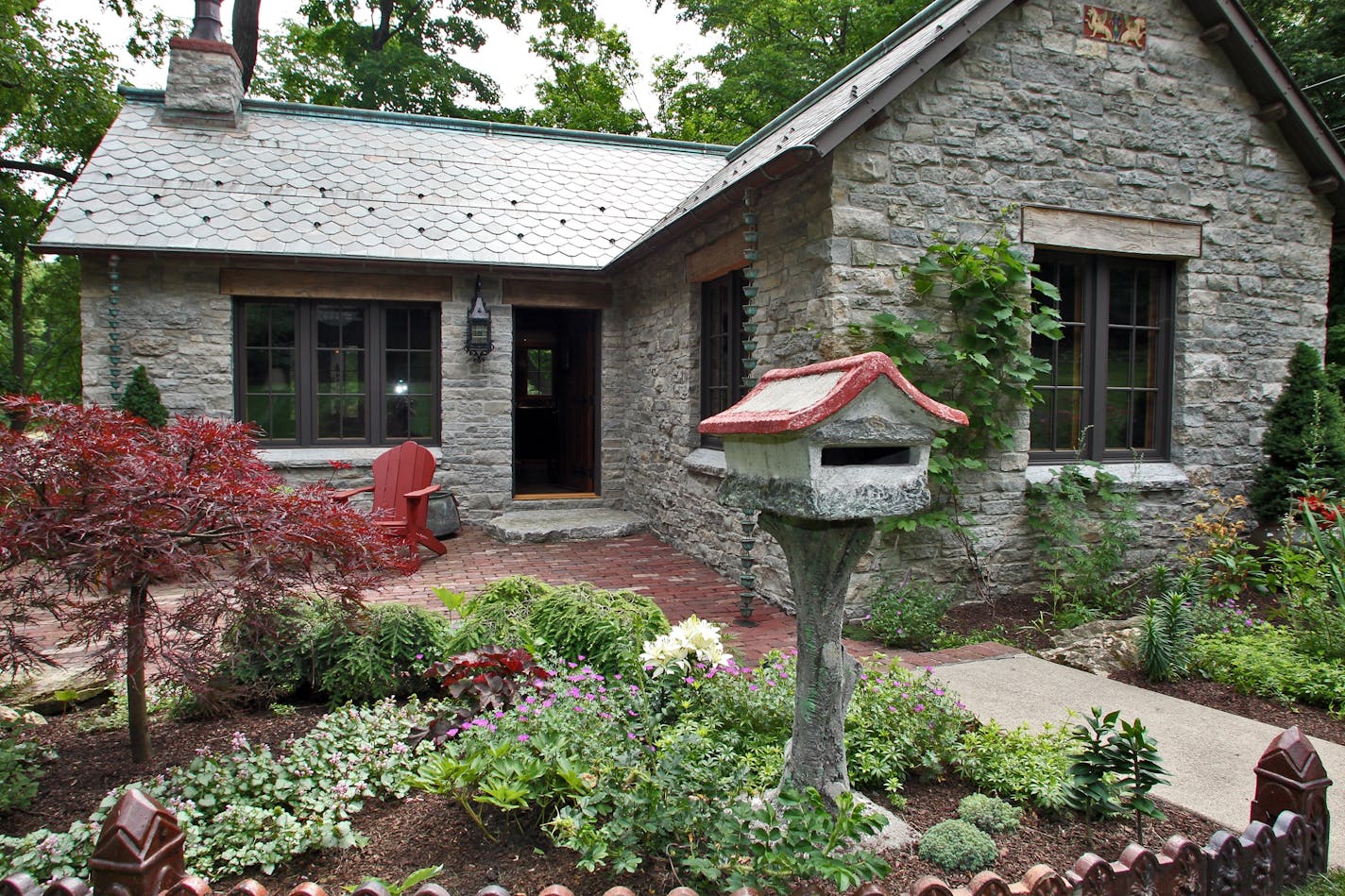 Newly renovated stone cottage with Old Age French features in Deephaven. Exterior of cottage.