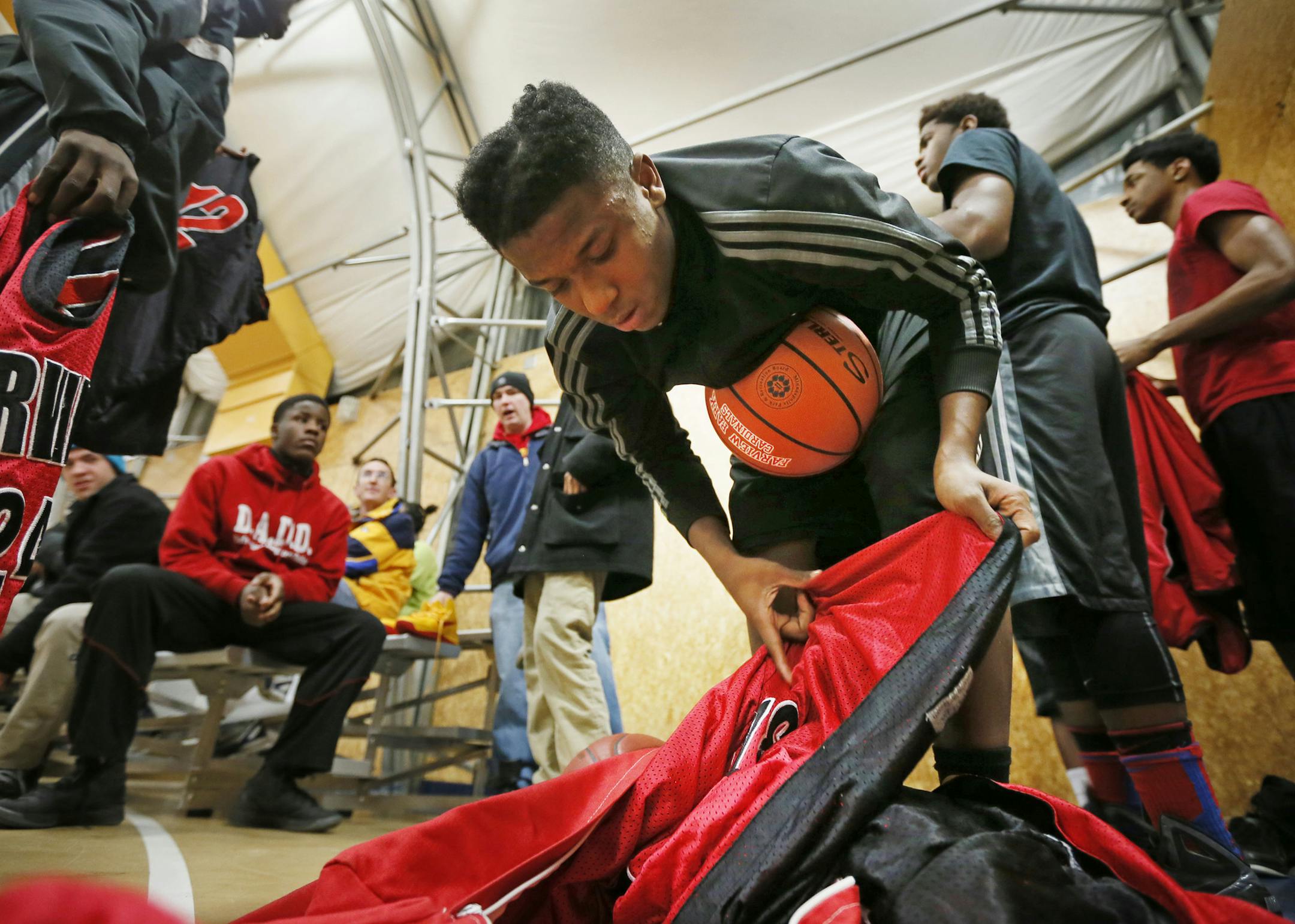 Malik Morgan and his team form Fairview Park got dressed during a recent basketball game that his team won in northeast Minneapolis. JERRY HOLT ‚Ä¢ jerry.holt@startribune.com