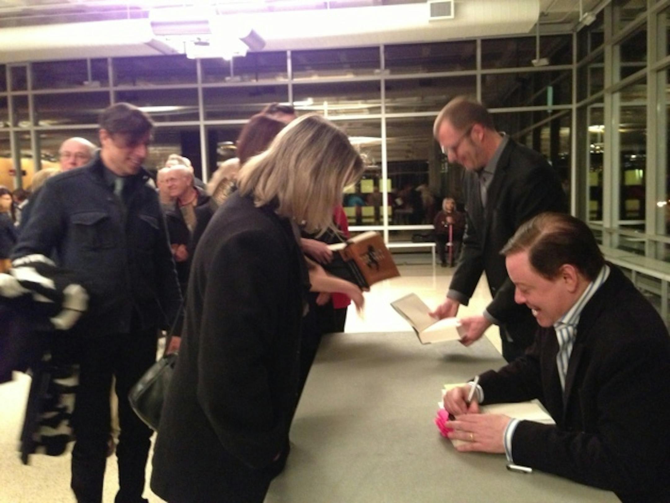 A long line snaked through the Hill Ballroom at Macalester during Andrew Solomon's book-signing.