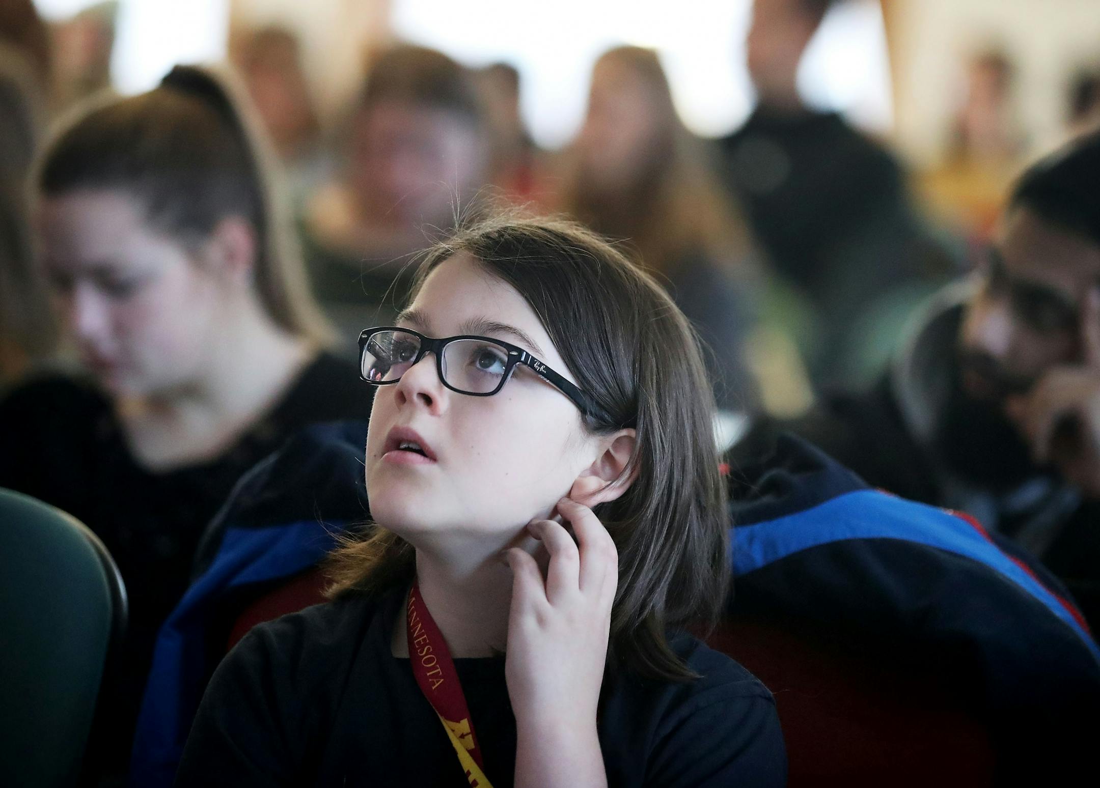 Elliott Tanner, 11, who hopes to be a theoretical physicist, looks up at a monitor during his Earth and Environment class at the University of Minnesota.