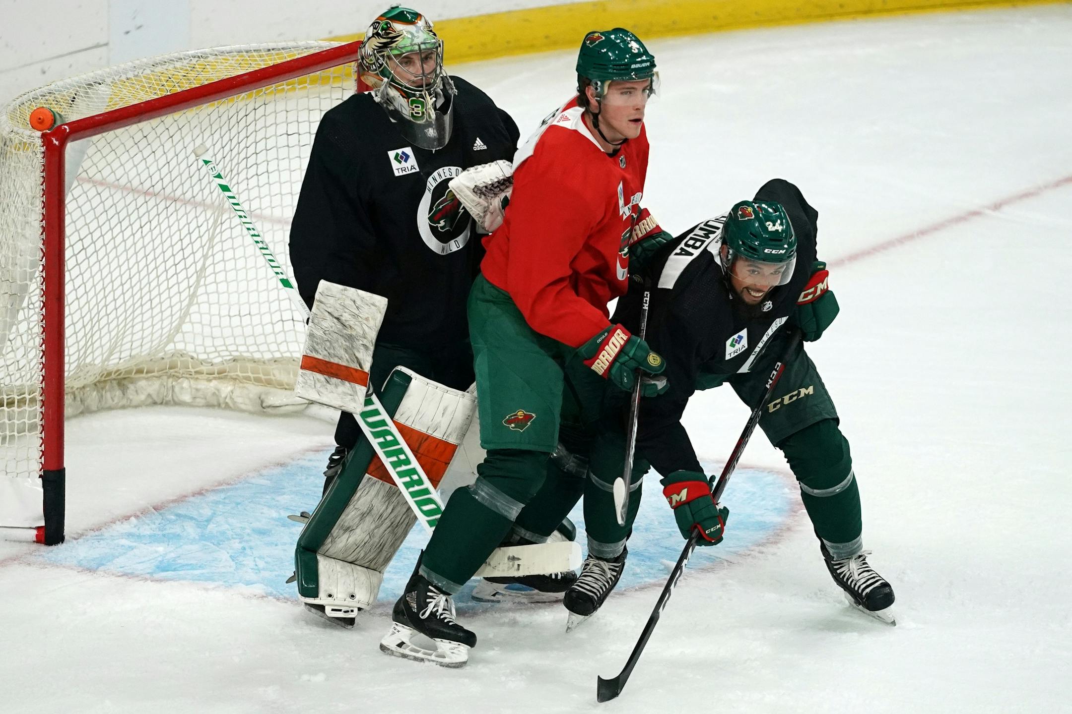 Minnesota Wild center Charlie Coyle (3) and Minnesota Wild defenseman Matt Dumba (24) fought for position in front of the net.