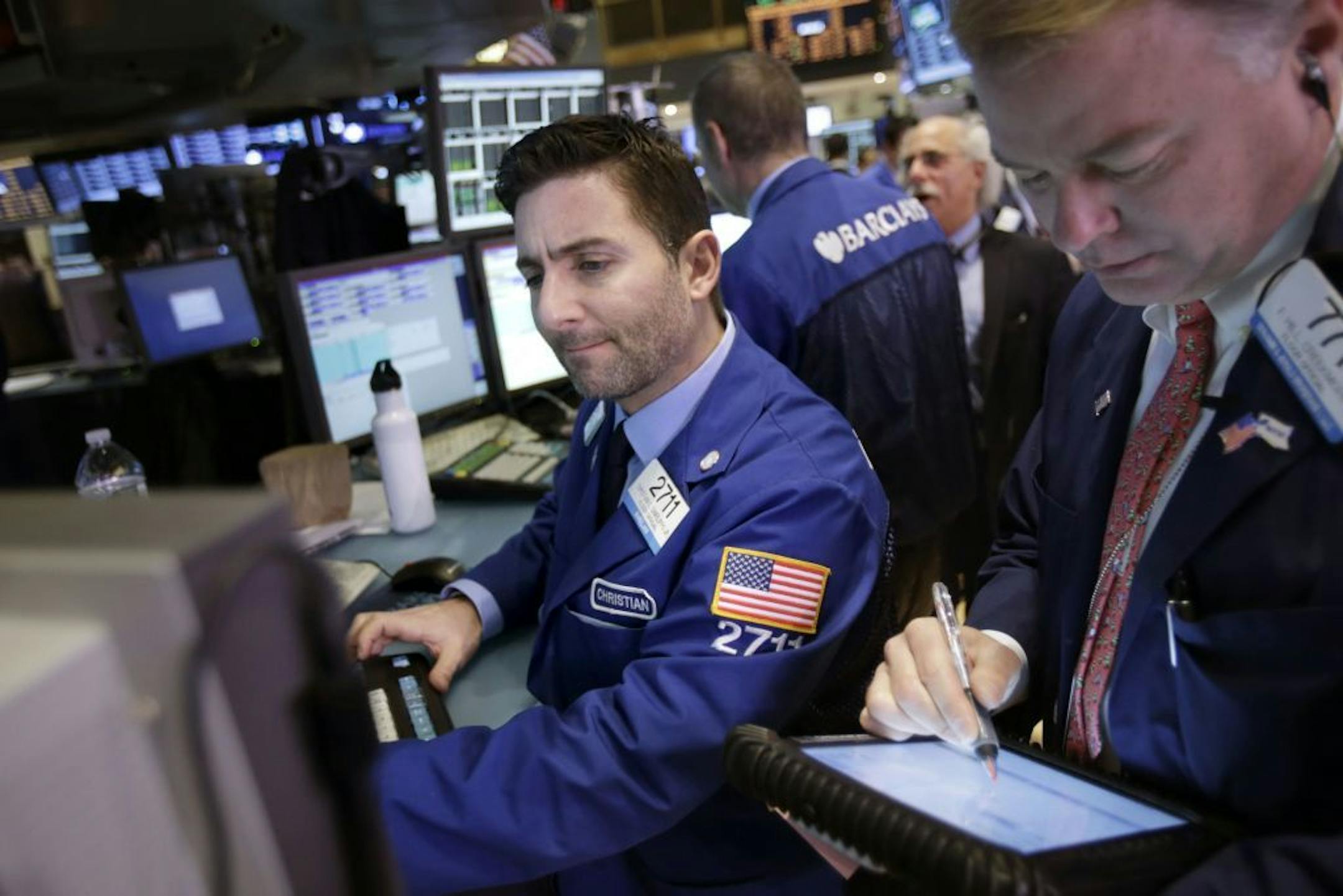 Traders work on the floor at the New York Stock Exchange in New York, Wednesday, Jan. 2, 2013. The �fiscal cliff� compromise, for all its chaos and controversy, was enough to send the stock market shooting higher Wednesday, the first trading day of the new year.