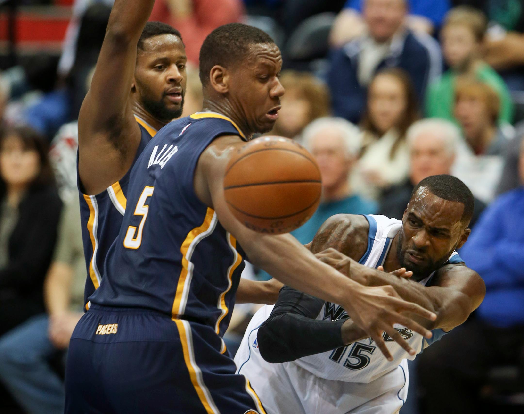 Minnesota Timberwolves center Gorgui Dieng (5) attempted to pass around Indiana Pacers forward Lavoy Allen (5) in the first half Sunday night at Target Center.