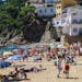Cliffside inns, homes and restaurants climb the hill above the beach in Llfranc, Costa Brava, Catalonia, Spain. (Courtesy Steve Haggerty/Colorworld/MC