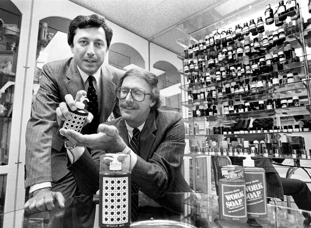 Minnetonka Corp. executives Wally Marx, left, and Robert Taylor, right, displayed a Softsoap dispenser in 1981.