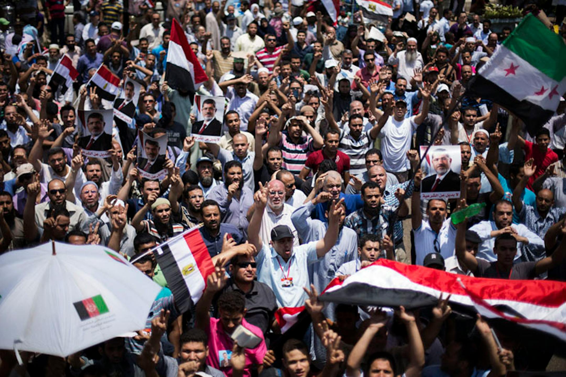 Supporters of Egypt's Islamist President Mohammed Morsi rally near Cairo University in Giza, Egypt, Tuesday.
