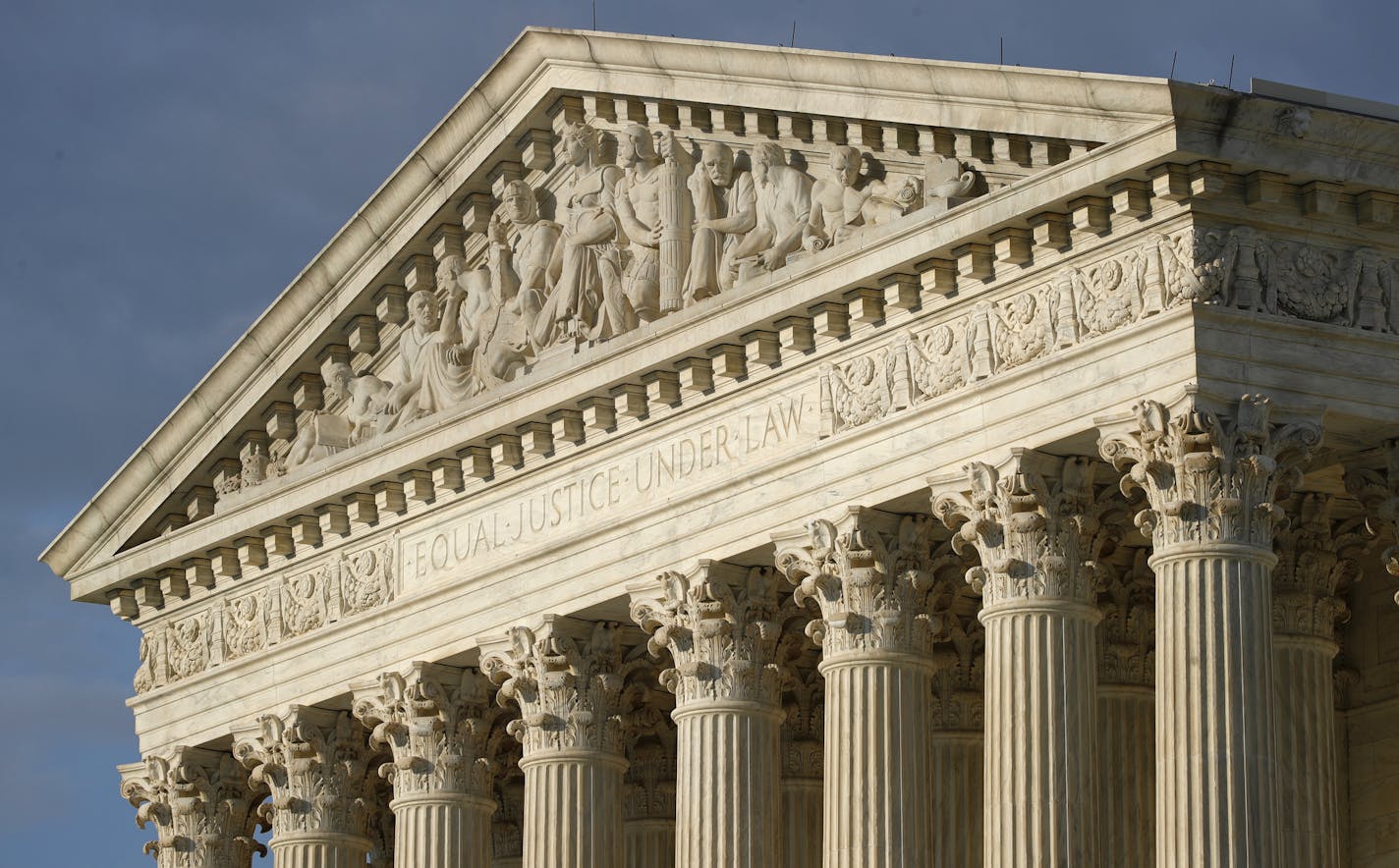 FILE - In this May 3, 2020 photo, the setting sun shines on the Supreme Court building on Capitol Hill in Washington. (AP Photo/Patrick Semansky, File)