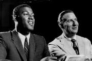 Elgin Baylor signed with the Lakers, and team president Bob Short, in 1958.