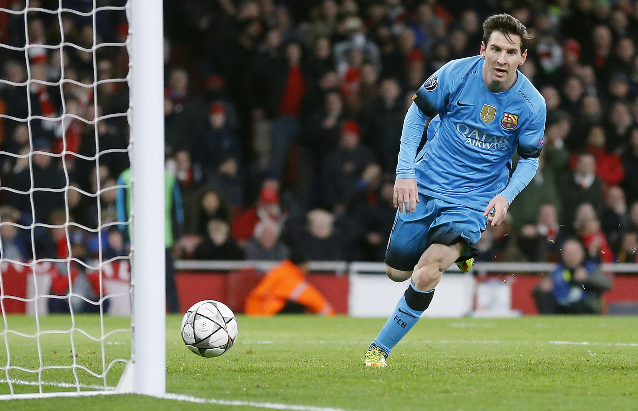 Barcelona's Lionel Messi celebrates after scoring during the Champions League round of sixteen first leg soccer match between Arsenal and Barcelona at the Emirates stadium in London, Tuesday, Feb. 23, 2016.(AP Photo/Frank Augstein)