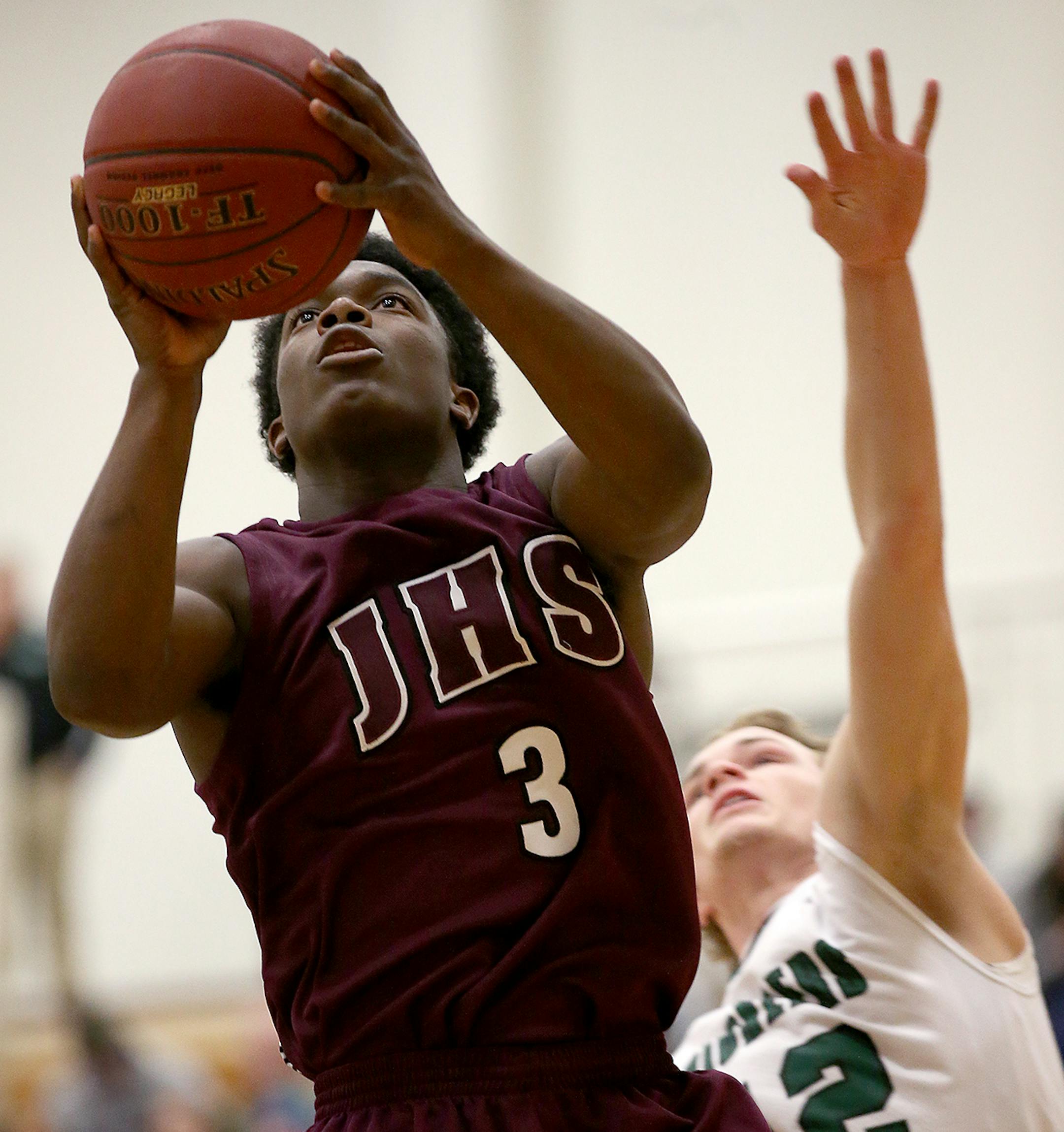 St. Paul Johnson's Jalen Mobley went up for two despite pressure from Hill-Murray's Sam Westby during the first half in the Class 3A, Section 4, boys' basketball final at Washington Tech Magnet School, Thursday, March 5, 2015 in St. Paul, MN. ] (ELIZABETH FLORES/STAR TRIBUNE) ELIZABETH FLORES • eflores@startribune.com ORG XMIT: MIN1503052120230566