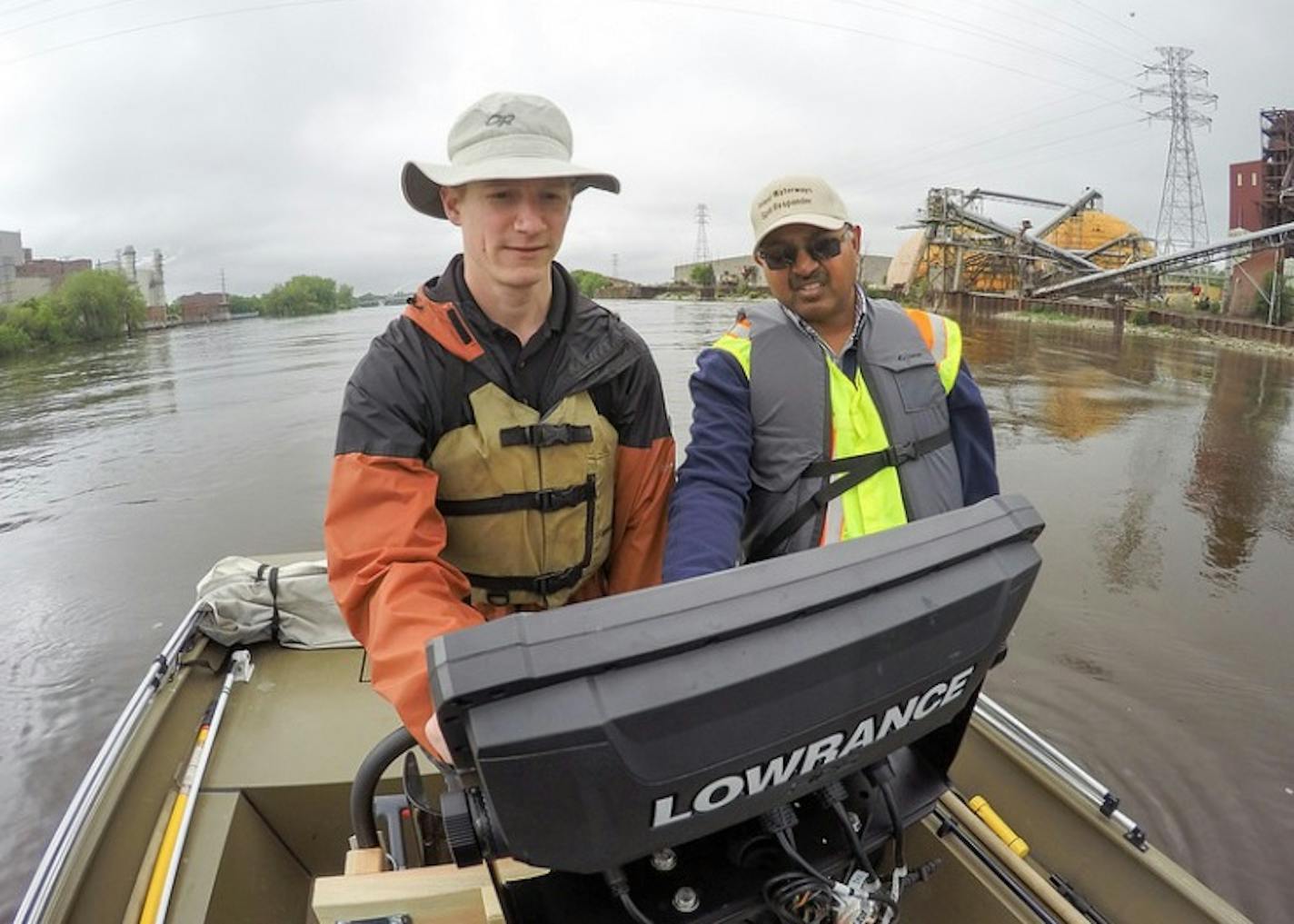 Researchers Brian Jastram and Udai Singh map the underwater topography of the Mississippi River's upper reaches in Minneapolis near the city's former barge terminal..