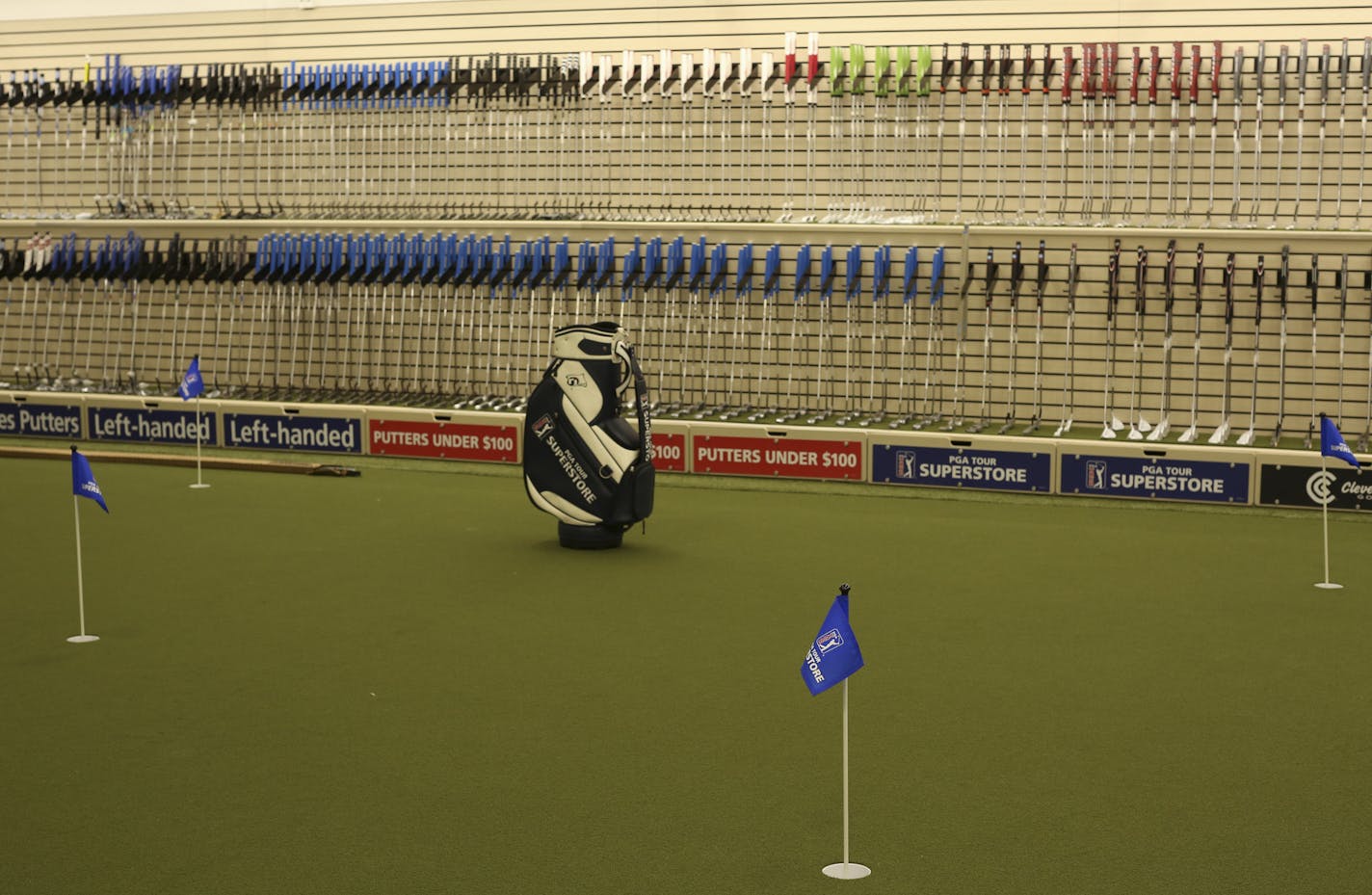 There's a big putting green to try out the many putters on display at the PGA Tour Superstore. ] JEFF WHEELER &#xef; jeff.wheeler@startribune.com A PGA Tour Superstore will open in Minnetonka Saturday. On Wednesday afternoon, June 8, 2016 inventory was being labeled and arranged ahead of the grand opening.