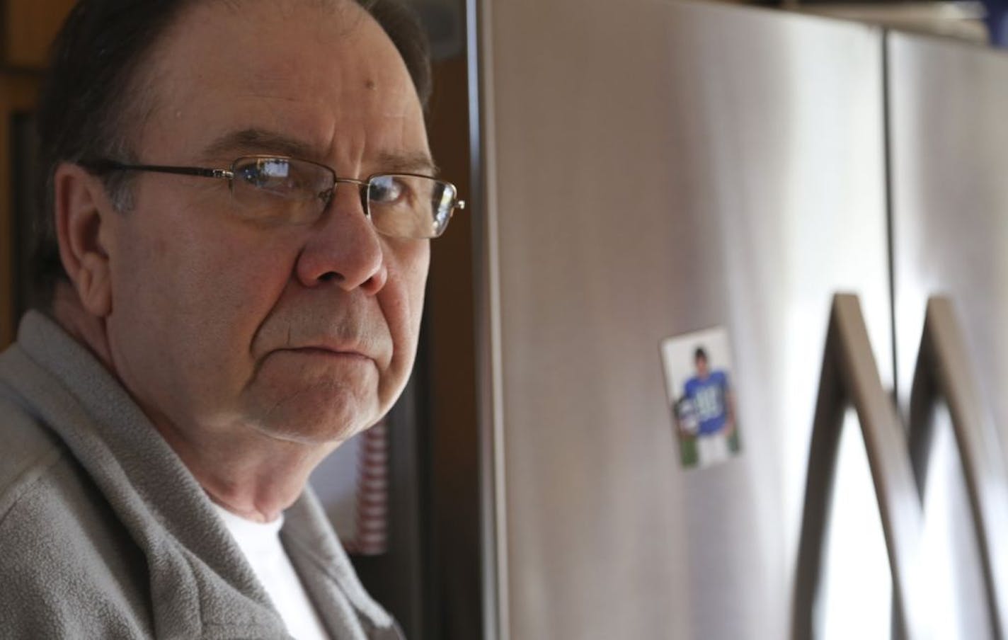 The Don Mele stood near his Sears Kenmore refrigerator that has small rust spots in was suppose to be stainless steel fronts in their home in Eagan, Min., Thursday December 6, 2012. Mele who retired from the scrap metal business knew that real stainless steel shouldn't be able to hold a magnet.