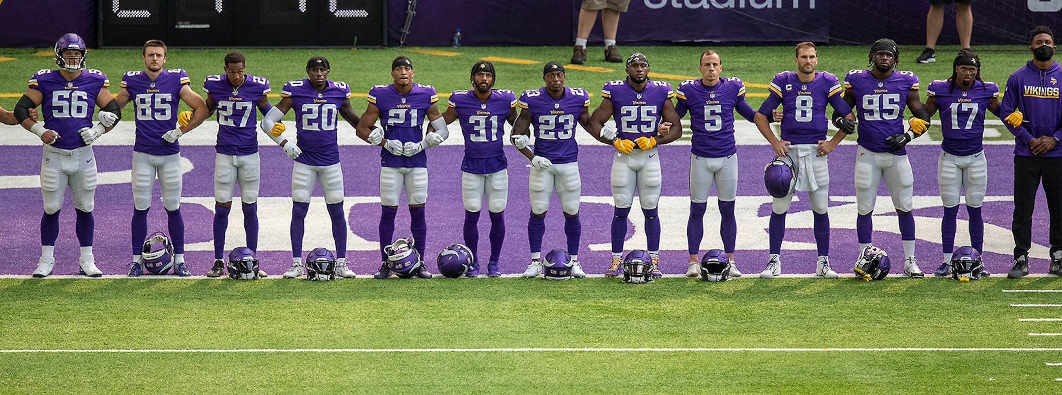 Vikings players stood to honor George Floyd on the field before the Vikings took on the Green Bay Packers.