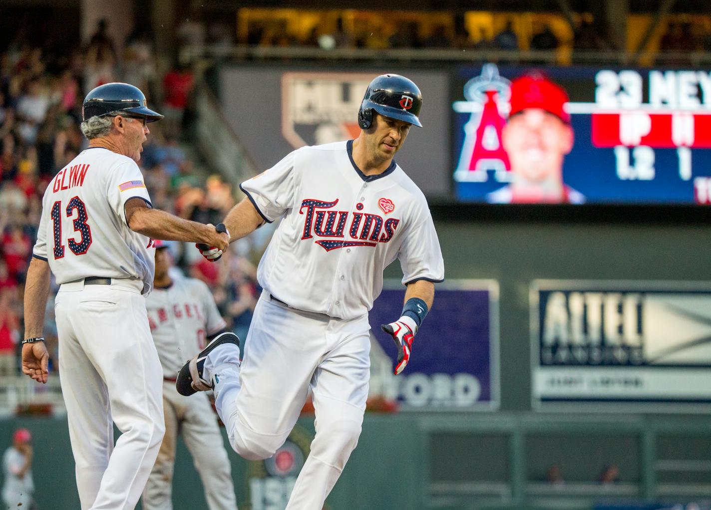 Minnesota Twins' Joe Mayer shakes Gene Glynn's hand while running the bases after hitting a homerun during a game against the Los Angeles Angels on Monday, July 3, 2017, at Target Field. ] COURTNEY PEDROZA &#x2022; courtney.pedroza@startribune.com July 3, 2017; Angels at Twins; Target Field;
