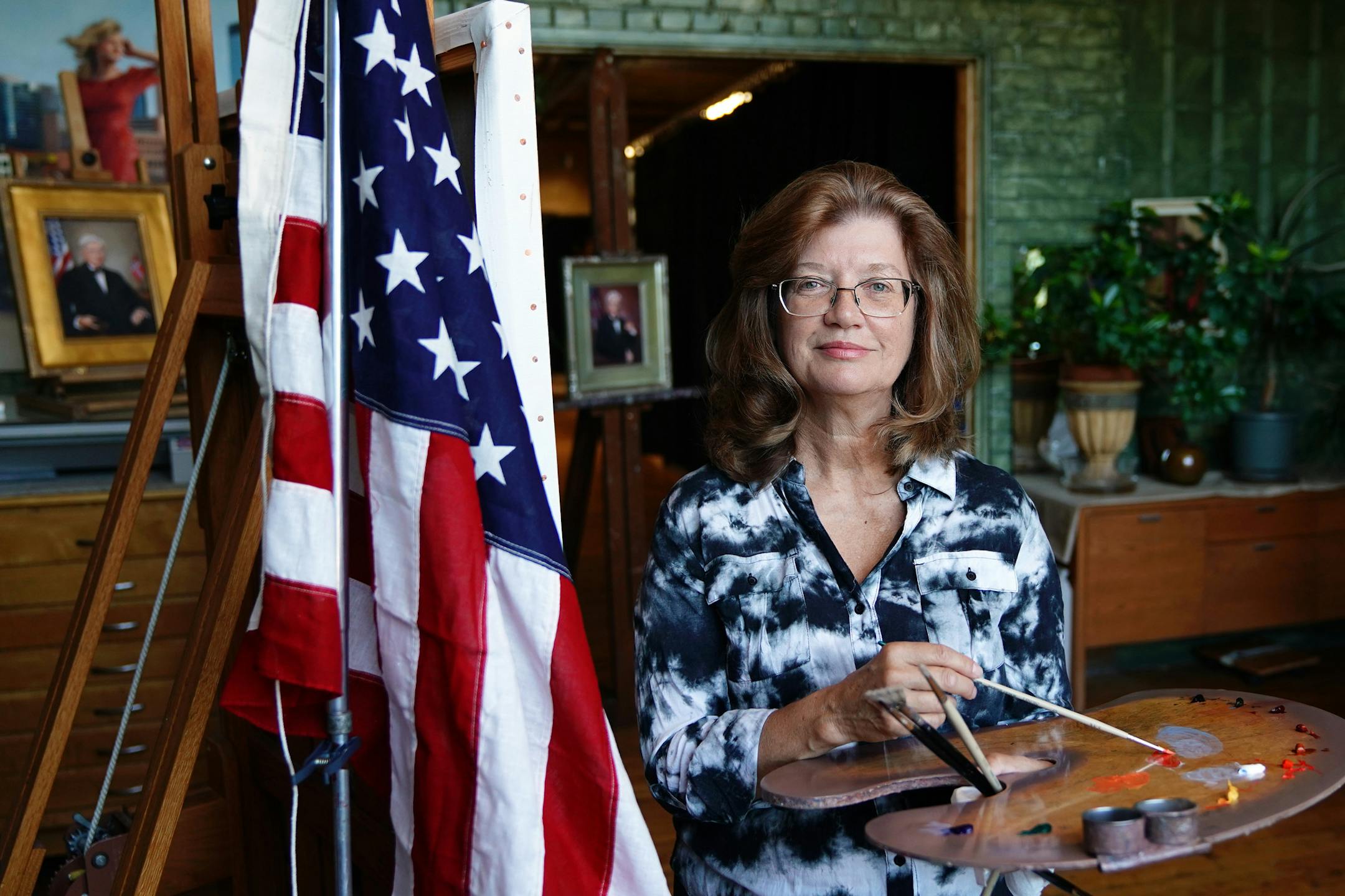 Minneapolis portrait artist Cyd Wicker, who has been commissioned to paint several posthumous portraits of Minnesota federal judges, stood for a photo in her studio Tuesday. ] ANTHONY SOUFFLE ï anthony.souffle@startribune.com Minneapolis portrait artist Cyd Wicker, who has been commissioned to paint several posthumous portraits of Minnesota federal judges, stood for a photo in her studio Tuesday, July 24, 2018 in Minneapolis.