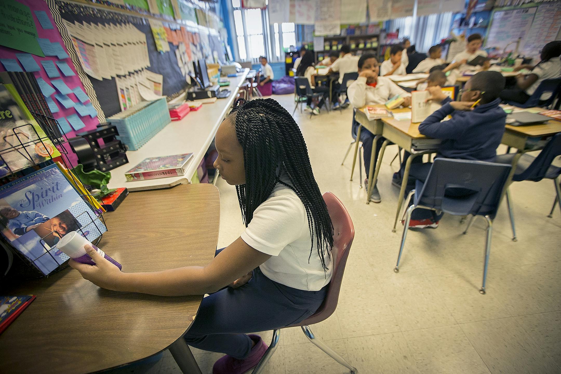 A "Calm Down Bottle" or a "Peace Corner" can be found in each classroom at Marcus Garvey Elementary School, Tuesday, March 21, 2017 in Chicago, IL. The glitter bottles are placed to help students calm their emotions. In this case a student decided to go to a corner to calm her stress.