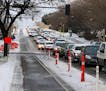 Vehicles were backed up along S. 28th Street in Minneapolis during a morning commute while the bike lanes stood empty.